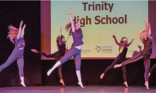  ??  ?? Hello Trinity High School pupils dance to the popular Adele song