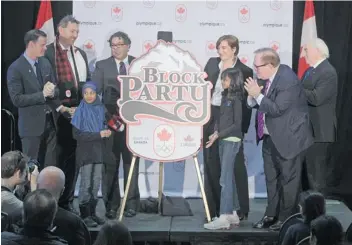  ?? Stuart Gradon/Calgary Herald ?? Former Olympian Mark Tewksbury, from left, Minister of Tourism Richard Starke, mayor Naheed Nenshi, Banff mayor Karen Sorensen, Canadian Olympic Committee president Marcel Aubut, and Canadian Olympic Foundation board member Doug Mitchell take part in...