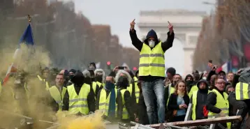 ??  ?? ANGER: A protester wearing a ‘gilet jaune’, or yellow vest, a symbol of the French demonstrat­ions