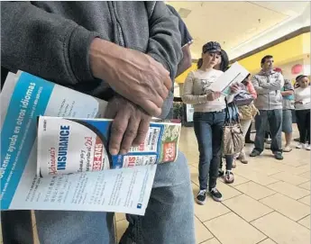  ?? Irfan Khan Los Angeles Times ?? ENROLLEES AT a Covered California event in Panorama City in 2014. Unlike other states that resisted the Affordable Care Act, California used it to expand Medicaid, contain expenses and protect consumers.