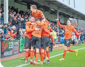  ??  ?? Sam Stanton celebrates after scoring the winner for Dundee United at Gayfield.