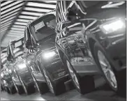  ?? MICHAEL SOHN, FILE/AP PHOTO ?? Volkswagen cars are pictured during a final quality control at the Volkswagen plant in Wolfsburg, Germany.