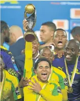  ?? Picture: GALLO IMAGES ?? WANTED MAN: Keagan Dolly and his Mamelodi Sundowns teammates celebrate the Caf Champions League victory against Zamalek at Borg El Arab Stadium in Alexandria, Egypt, last year