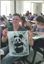  ?? PROVIDED TO CHINA DAILY ?? Hungarian student Fekete Marcell Zoltan shows his ink painting at the summer camp.