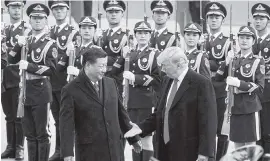  ?? ARTYOM IVANOV/TASS TNS ?? Back in 2017, China's President Xi Jinping and President Trump prepared to shake hands during a meeting outside the Great Hall of the People in Beijing.