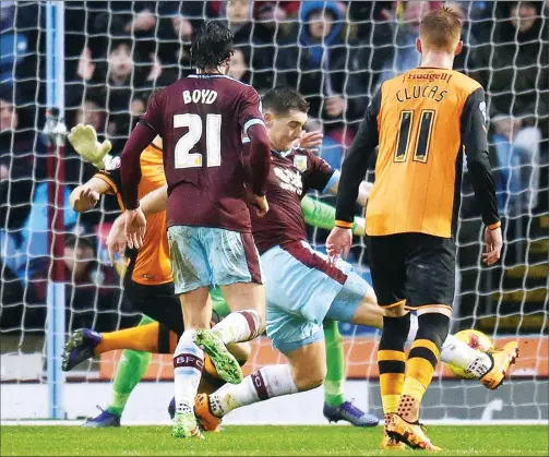  ??  ?? SLAMMING SAM: Striker Sam Vokes scores the game’s only goal against Wolves