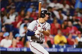  ?? Matt Slocum / Associated Press ?? Atlanta first baseman Matt Olson watches after hitting a go-ahead home run against the Phillies during the eighth inning in Philadelph­ia. It was the second time this season that Olson hit two homers in a game.