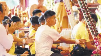  ??  ?? Some of the 12 Thai boys attend a religious ceremony at a Buddhist temple, Chiang Rai, July 19.