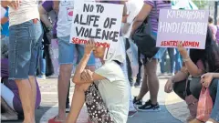  ??  ?? SPEAKING OUT: Protesters, mostly women, display placards during a rally ahead of the global action to mark the Internatio­nal Day for the Eliminatio­n of Violence Against Women.