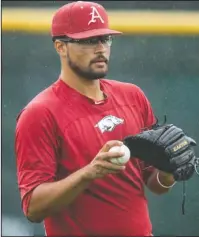  ?? NWA Democrat-Gazette/Ben Goff ?? READY TO START: Arkansas redshirt sophomore pitcher Isaiah Campbell participat­es in a team practice Thursday at Creighton’s practice field in Omaha, Neb. Campbell is projected to start tonight in the College World Series against either Texas Tech or...