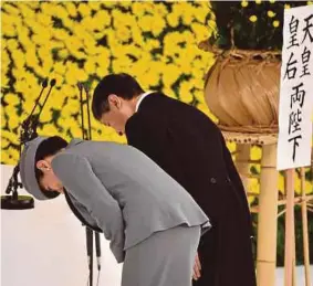  ?? (Foto AFP) ?? Maharaja Naruhito dan Maharani Masako pada majlis memperinga­ti mangsa perang di Dewan Nippon Budokan di Tokyo, Jepun.