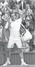  ?? PETER VAN DEN BERG/USA TODAY SPORTS ?? Roger Federer waves farewell to the Centre Court fans after losing to Hubert Hurkacz in the Wimbledon quarterfin­als in 2021.