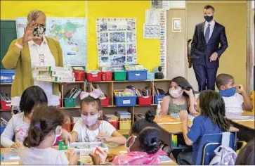  ?? Santiago Mejia San Francisco Chronicle ?? CALIFORNIA Gov. Gavin Newsom visits Oakland’s Carl B. Munck Elementary on Wednesday, the day he announced the state will require school employees to be vaccinated against COVID or undergo weekly testing.