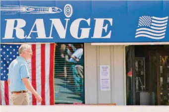  ?? Chris Kaufman/Special to The Chronicle 2020 ?? Jerod Johnson, owner of the Range and Boy Scout troop leader, attends a Father’s Day gun sale at Miwall Corp. in June 2020 in Grass Valley (Nevada County).