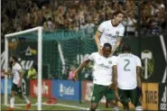  ?? SEAN MEAGHER — THE OREGONIAN VIA AP ?? In this July 28, 2018, file photo, Portland Timbers’ Fanendo Adi, second from right, celebrates with teammates after scoring a goal in the second half goal of an MLS soccer game against the Houston Dynamo in Portland, Ore. A fifteen-match unbeaten...