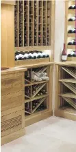  ??  ?? Denise Carruthers’ butternut wood wine cellar is paired with tumbled travertine stone flooring, and can hold 1,400 bottles. “I wanted it to look very rustic Italian,” she says.