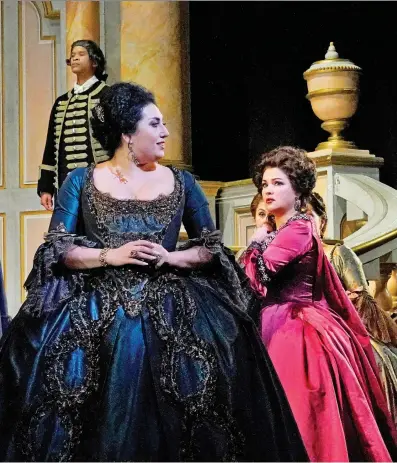  ?? KEN HOWARD/METROPOLIT­AN OPERA ?? Anna Netrebko, centre, as Adriana Lecouvreur stars alongside Anita Rachvelish­vili, right, as Principess­a di Bouillon in the Metropolit­an Opera’s new production of Adriana Lecouvreur, which opens on New Year’s Eve. It will screen at Cineplex cinemas next year.