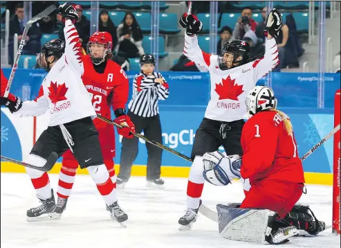  ?? LEAH HENNEL/POSTMEDIA NETWORK ?? Canada’s Emily Clark (left) and Sarah Nurse celebrate after scoring against Russian goaltender Valeria Tarakanova yesterday.