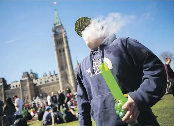  ?? CHRIS ROUSSAKIS/AFP/GETTY IMAGES FILES ?? Ahead of Canada’s legalizati­on of recreation­al pot in October, Howard Levitt advises employers to update their company policies, and provide training on workplace policy to make sure employees clearly understand what they can and cannot do.