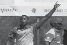  ??  ?? Kagiso Rabada celebrates Hamilton Masakadza’s wicket. Pic: ESPNCricIn­fo