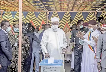  ?? — AFP photo ?? Deby casts his ballot at a polling station in N’djamena.