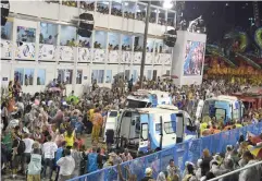  ?? — AFP ?? Ambulances are seen after people were ran over by a float of the Paraiso do Tuiuti samba school at the entrance of the Sambadrome during the first night of Rio’s Carnival in Brazil.