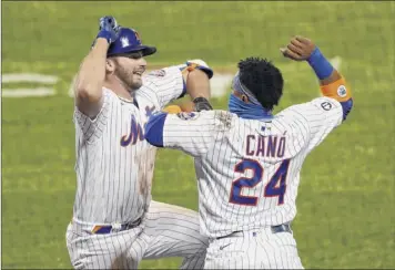  ?? Jim Mcisaac / Getty Images ?? Pete Alonso, left, celebrates his fourth-inning home run against the Rays with Mets teammate Robinson Cano. With five games left, Mets playoff hopes are slim, but they’re not eliminated.