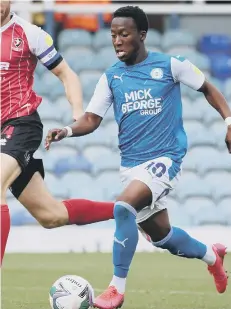  ??  ?? Siriki Dembele on the ball for Posh