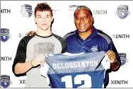  ?? PHOTO SUBMITTED ?? Cole DelosSanto­s receives his game jersey from George Teague, a nine-year veteran of the NFL, who coached the East team in the All-American Bowl game in Dallas, Texas.