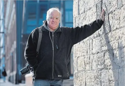  ?? PHOTOGRAPH BY BARRY GRAY, THE HAMILTON SPECTATOR ?? Jim Charlton, at 72 and retired, explores the streets of Hamilton through the eye of his camera searching for hidden signs of our architectu­ral past.