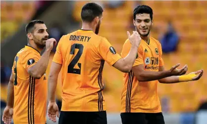  ??  ?? Raúl Jiménez (right) celebrates after scoring the goal against Olympiakos on Thursday that took Wolves into the Europa League quarterfin­als. Photograph: Laurence Griffiths/Getty Images