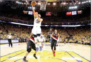  ?? EZRA SHAW/GETTY IMAGES/AFP ?? Stephen Curry of the Golden State Warriors goes up for a shot against the Portland Trail Blazers in Game 2 of the Western Conference quarterfin­als.