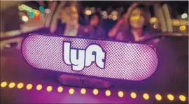  ?? Josh Edelson Associated Press ?? THE SETTLEMENT against Lyft helps the firm by averting a costly trial and allowing it to keep operating without having to classify its drivers as employees.