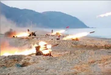  ?? KCNA VIA KNS/AFP ?? A firing contest among multiple launch rocket system batteries selected from large combined units of the KPA at an undisclose­d location in North Korea.