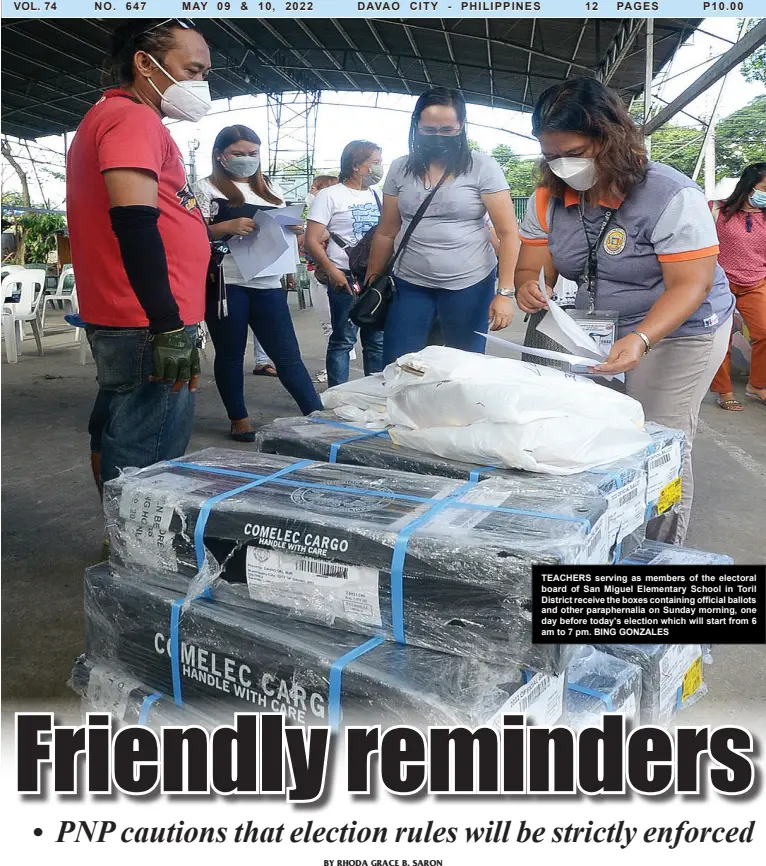  ?? BING GONZALES ?? TEACHERS serving as members of the electoral board of San Miguel Elementary School in Toril District receive the boxes containing official ballots and other parapherna­lia on Sunday morning, one day before today's election which will start from 6 am to 7 pm.