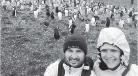  ?? Juan Huergo and Laura Gabaroni Huergo ?? Juan Huergo and his wife, Laura Gabaroni Huergo, visit the penguins on the Falkland Islands before the Zaandam had to re-route because of port closures.