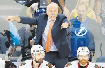  ?? Mike Carlson Getty Images ?? JOEL QUENNEVILL­E of the Chicago Blackhawks has outcoached his Tampa Bay counterpar­t, Jon Cooper, in the Stanley Cup Final series, changing lineups and getting matchups he wants even on the road.