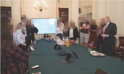  ?? Photograph: Cabinet Office/PA ?? Boris Johnson, right, at a gathering celebratin­g his birthday in the Cabinet Room at 10 Downing Street in June 2020, at which cake and alcohol were available.