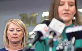  ?? ERICA BRECHTELSB­AUER/USA TODAY NETWORK ?? Tracy Tubbs, Bailey Holt’s aunt, stands by as Jackie Reid speaks for Preston Cope’s family at a news conference.