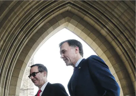  ?? SEAN KILPATRICK/THE CANADIAN ?? Finance Minister Bill Morneau, right, meets with U.S. Treasury Secretary Steve Mnuchin in Ottawa on Friday. “I think whatever we do, our objective is to make sure that (NAFTA) is positive for the U.S. economy and positive for the Canadian economy ...”...