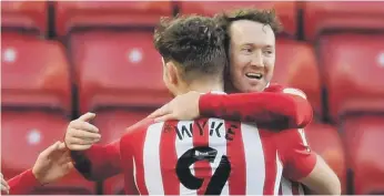  ??  ?? Charlie Wyke celebrates a goal with Aiden McGeady.