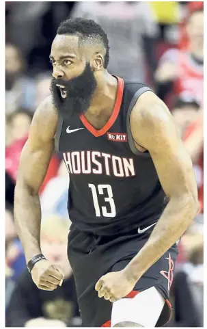  ?? — AP ?? On fire: Houston Rockets’ James Harden celebrates after dunking the ball against Los Angeles Lakers during the NBA game on Thursday.