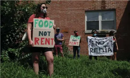  ?? Photograph: Leah Millis/Reuters ?? People gather outside an apartment complex with the intention to stop the alleged eviction of one of the tenants in Mount Rainier, Maryland, on Monday.