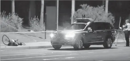  ?? Associated Press ?? A FATAL accident Sunday involving an Uber self-driving vehicle is under investigat­ion in Tempe, Ariz. Police said the vehicle hit a woman who was walking outside a crosswalk. Uber halted its driverless car tests in several cities and said it is...