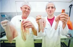  ?? Photo: Lawrence Smith/fairfaxnz ?? Skin in the game: Stewart Macdonald and Steve Kilgallon show off the results of their filleting.