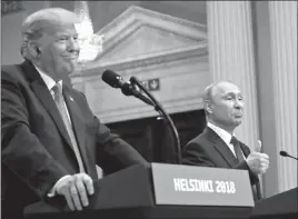  ?? PABLO MARTINEZ MONSIVAIS / ASSOCIATED PRESS ?? Russian President Vladimir Putin, right, gestures while speaking as President Donald Trump looks on during their joint news conference Monday in Helsinki.