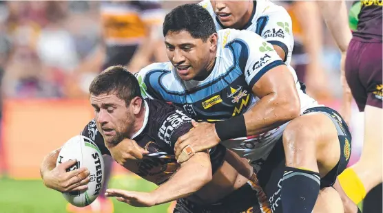  ?? Picture: DAN PELED/AAP ?? FIGHTING ON: Broncos’ Andrew Mccullough is tackled by Jason Taumalolo of the Cowboys, before the Tongan superstar succumbed to injury.
