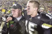  ??  ?? Joe Tiller and quarterbac­k Drew Brees celebrate after defeating Indiana to clinch a berth in the 2001 Rose Bowl. Brees is the Big Ten’s all- time leading passer and ranks third in NFL history in passing yards.
| AP FILES