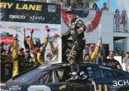  ?? MORRY GASH/AP ?? Richard Childress Racing driver Tyler Reddick celebrates in victory lane Sunday after winning the NASCAR Cup Series road race at Road America in Elkhart Lake, Wisconsin.