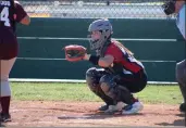 ?? SHAUN HOLKKO — DAILY DEMOCRAT ?? Woodland Christian sophomore Kylee Bihlman plays catcher during a 20-1victory at Encina Prep on Monday in Sacramento.